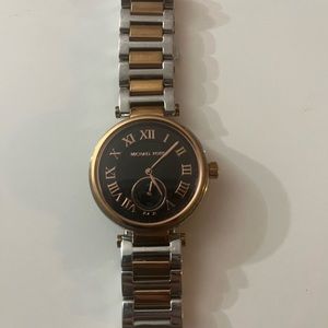 Rose gold and silver Micheal Kors women’s watch